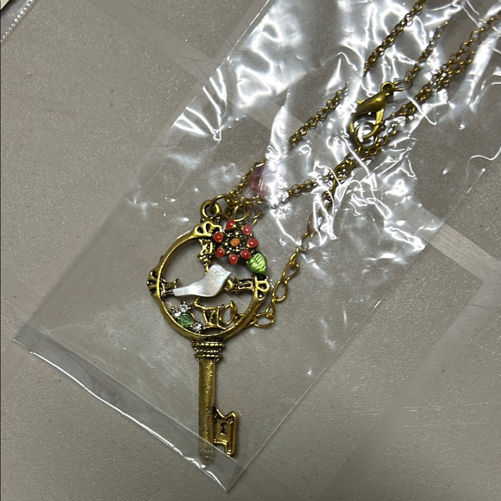 New Ornate Gold tone Key Necklace with Floral and Bird Details